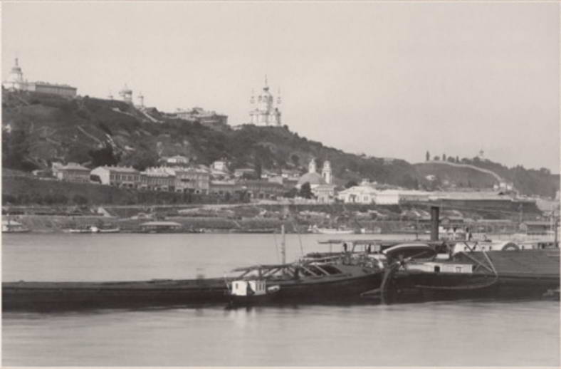 View of the Podil. Barges off the…